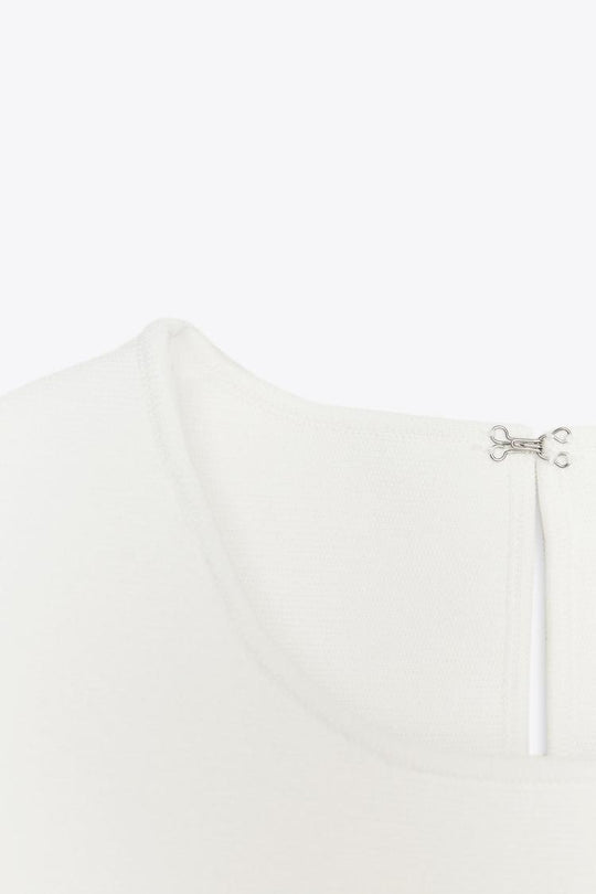 TOP EN MAILLE PÉPLUM AVEC LACETS